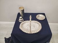 All three silver-tone items displayed together
