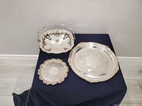 All three silver-plated pieces grouped to show sizes and styles