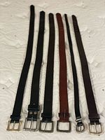 Six belts laid flat showing full length and color range
