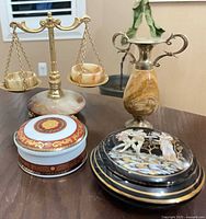 Group shot of four decorative pieces showing scale, urn vase, terracotta dish, porcelain box