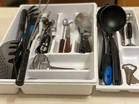 Cutlery trays filled with assorted utensils