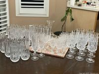 Full grouping of cut-glass stemware, decanter and marble/onyx board