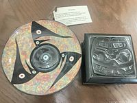 Top view of ceramic talking bowl and carved box together