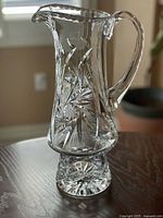 Flared crystal pitcher showing fan and starburst cuts