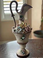 floral ewer front view showing applied flowers and overall form