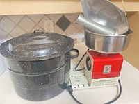OMRA tomato press next to Graniteware canning pot and lid