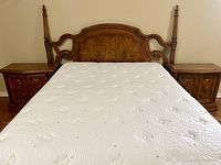 Front view of headboard, mattress and surrounding nightstands (nightstands not included)