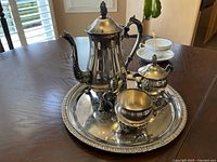 Full view of coffee pot, creamer, sugar bowl with tray