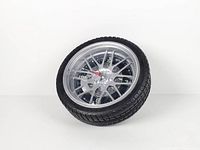 Full view of wheel-shaped clock angled