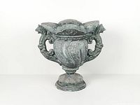 Front view showing full urn, handles, pedestal base