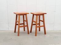 Front view of both wooden stools