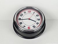 Front angled view showing full clock and case