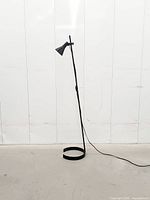 Full view of Ikea Lagra floor lamp showing height and semi-circular base