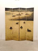 Full front view of four-panel folding screen with painted duck marsh scene