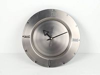 Front view of silver Skytimer wall clock showing dial and hands