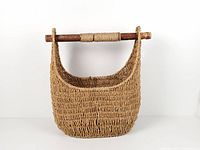 Front view of seagrass basket showing wooden handle and weave pattern