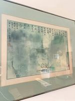 Front view of framed ink and watercolor painting with calligraphy showing artwork, mats and metal frame