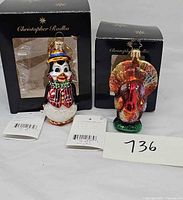 Both ornaments front view with boxes and tags