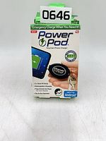 Front of boxed Power Pod keychain phone charger