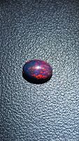 Front view of opal showing red and blue flashes