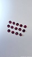 All 15 round rubies displayed on neutral background