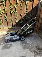 Side view of EGO cordless lawn mower showing full unit and branding