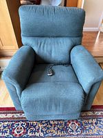 Front view of blue La-Z-Boy power recliner showing overall condition