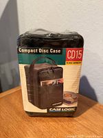 Front of sealed Case Logic CD15 package showing product image and capacity information