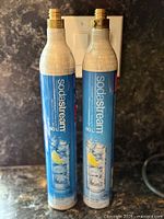 Front view of two SodaStream 60L CO2 cylinders standing upright