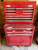 Front view of red Craftsman two-piece tool chest showing drawers and badges