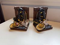 Front view of both firefighter gear resin bookends