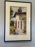 Full view of framed watercolor on wall