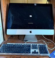 Front view of Apple iMac with keyboard