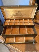 Box open showing removable tray and lid lining