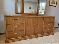 Full view of dresser credenza with attached tri-fold mirror