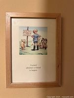Framed print showing illustration, caption, and full view of light wood frame
