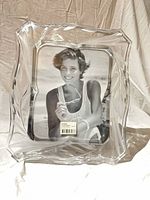 Front view of Mikasa crystal picture frame with sample photo inserted