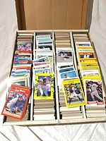 Long card storage box open, showing multiple columns of MLB baseball cards