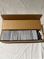 Cardboard box filled with sleeved basketball cards