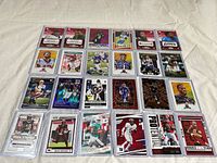 Wide view of all sleeved rookie cards laid out in rows