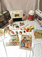 Overall lot layout with barn, silo, animals, vehicles, puzzles, books