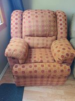 Front view of upholstered polka dot recliner