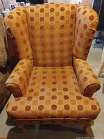 Front view of polka dot wingback chair