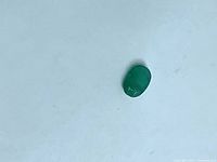 Front view of single oval green emerald