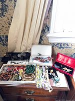 Overview of jewellery lot on dresser