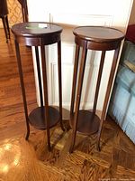Full view of both matching wooden plant stands
