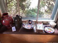 all five ceramic pieces on windowsill