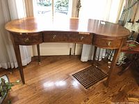 Full view of kidney-shaped desk front and legs