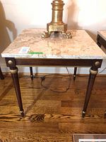 Full view of square end table showing marble top and wooden frame