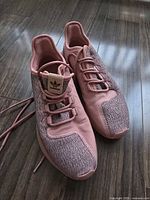 Top view of both sneakers showing uppers, laces, and colorway